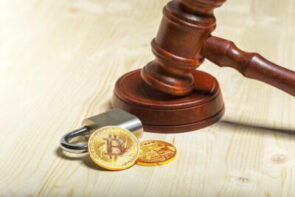 A gavel, cryptocurrency coin, and padlock.