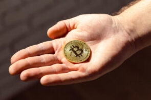 Crypto coin held in hand