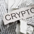 Newspaper with 'crypto' word visible.